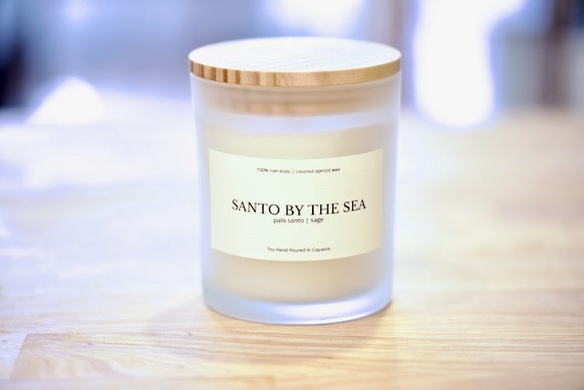 Santo by the Sea 7oz coconut apricot wax candle in frosted glass with wood lid, palo santo and sage, hand poured in Cayucos