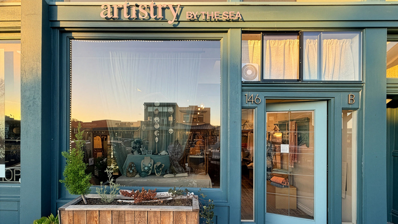 The Artistry By the Sea shopfront on Ocean Avenue at golden hour